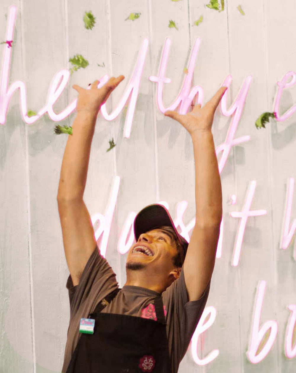 Put your hands in the air! A team member at tossed having fun
