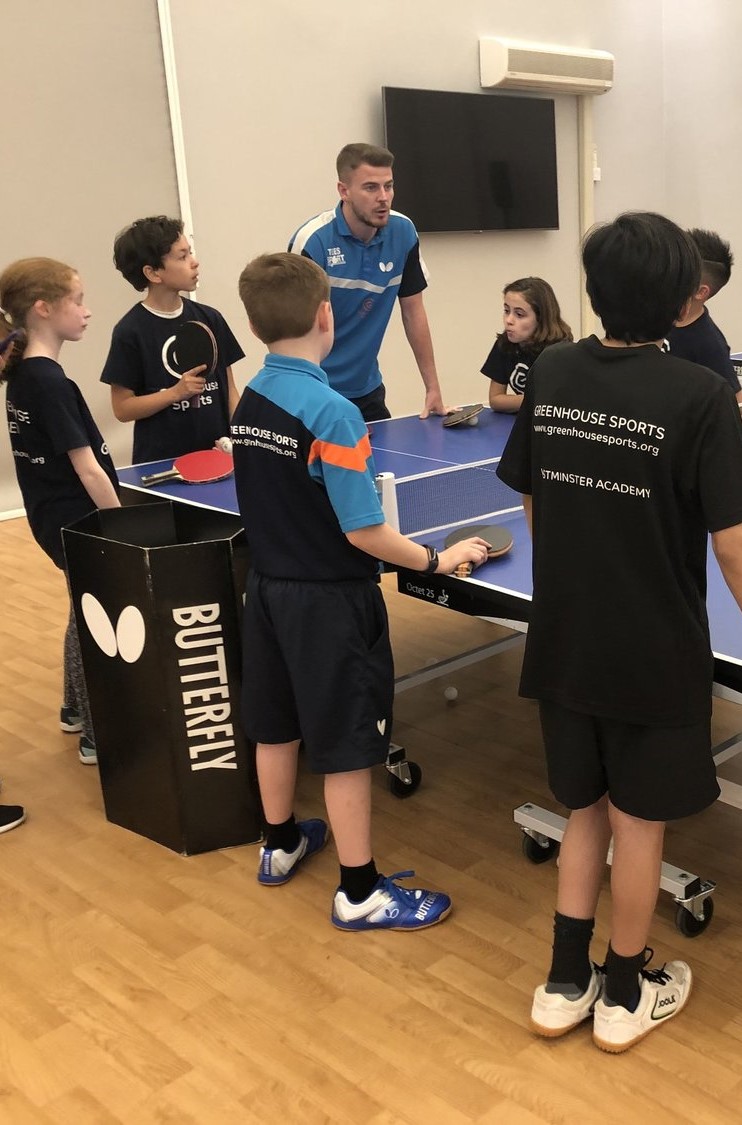 Young people playing table tennis